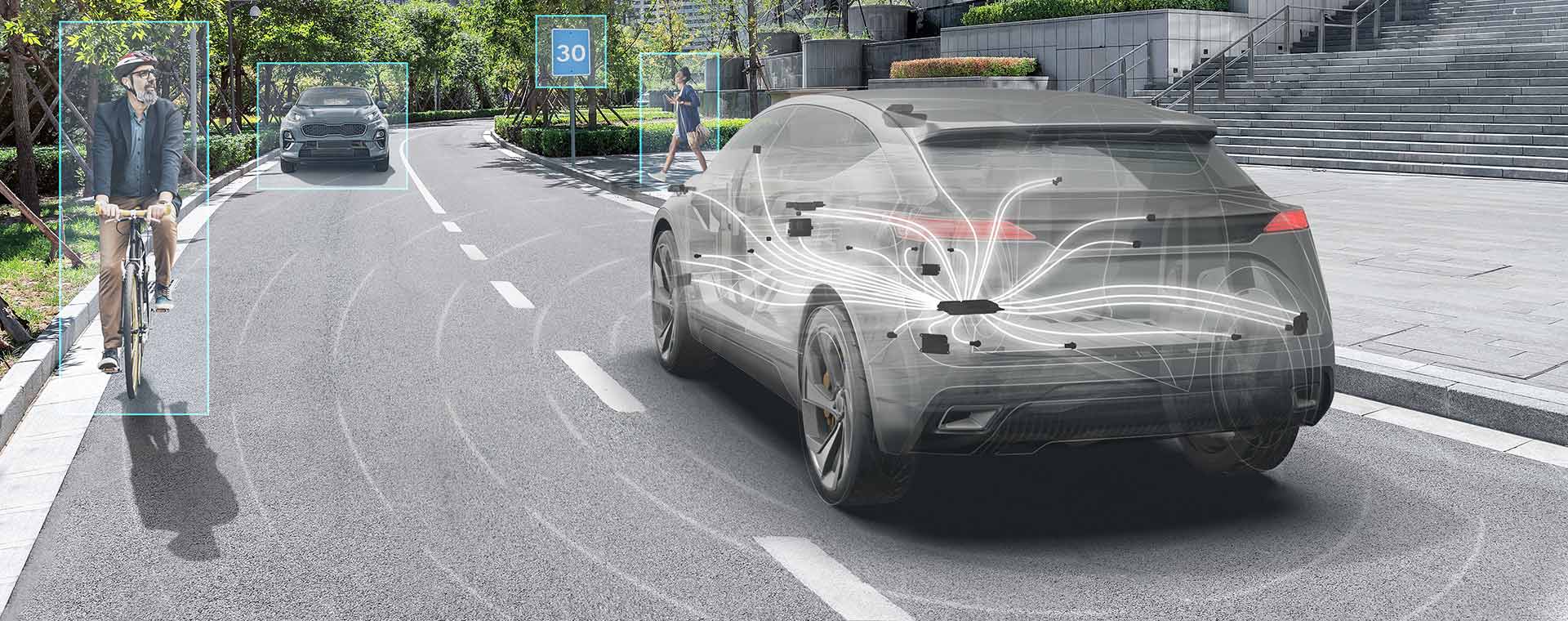 Ghosted grey vehicle driving along a road showing all of the ADAS sensors