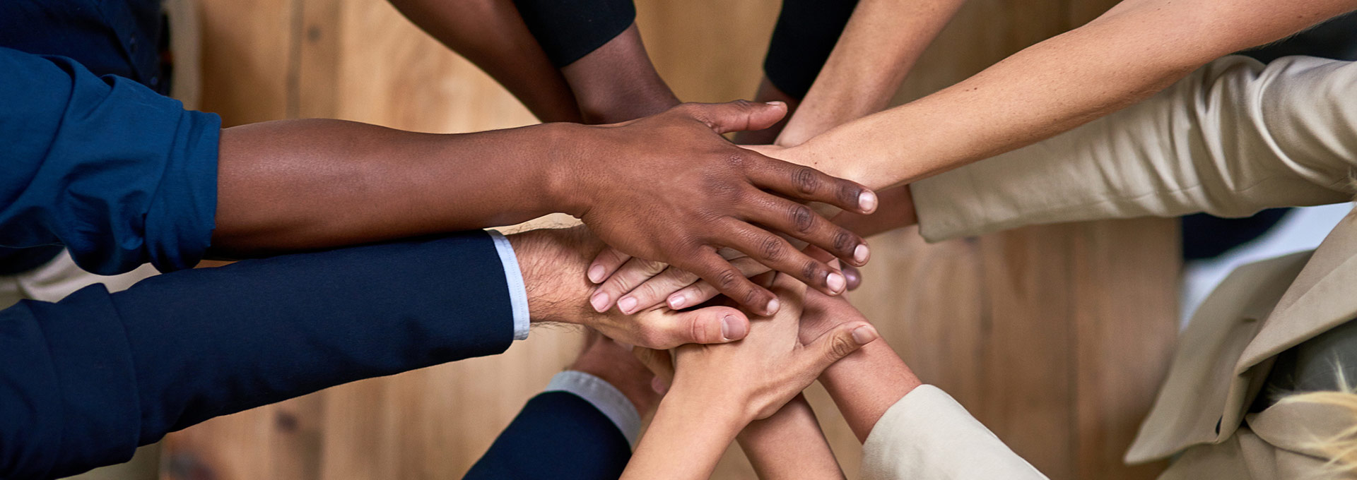 Group of hands coming together