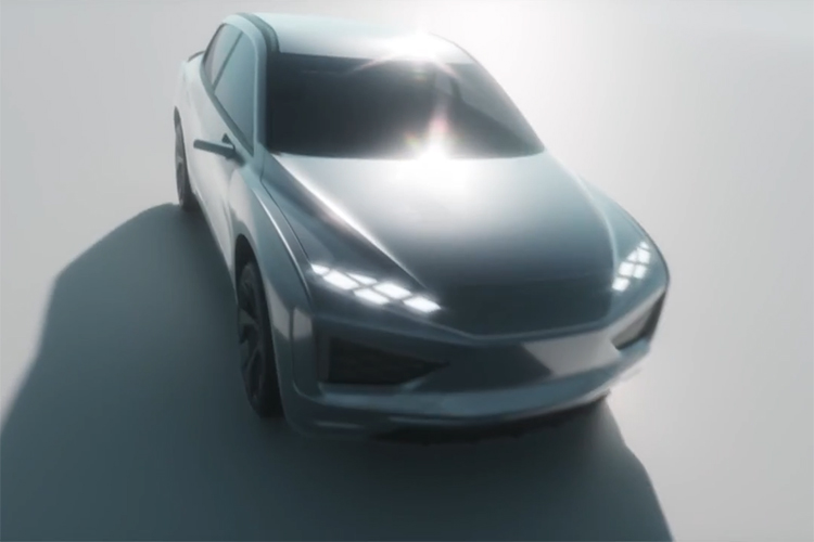 Grey vehicle with lights on facing forward