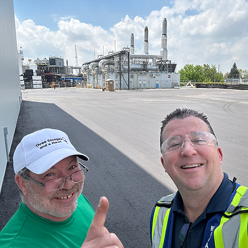 Paul Blackburn with an employee at Polycon