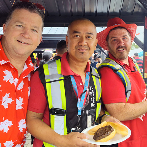 Paul Blackburn with employees at a company barbeque